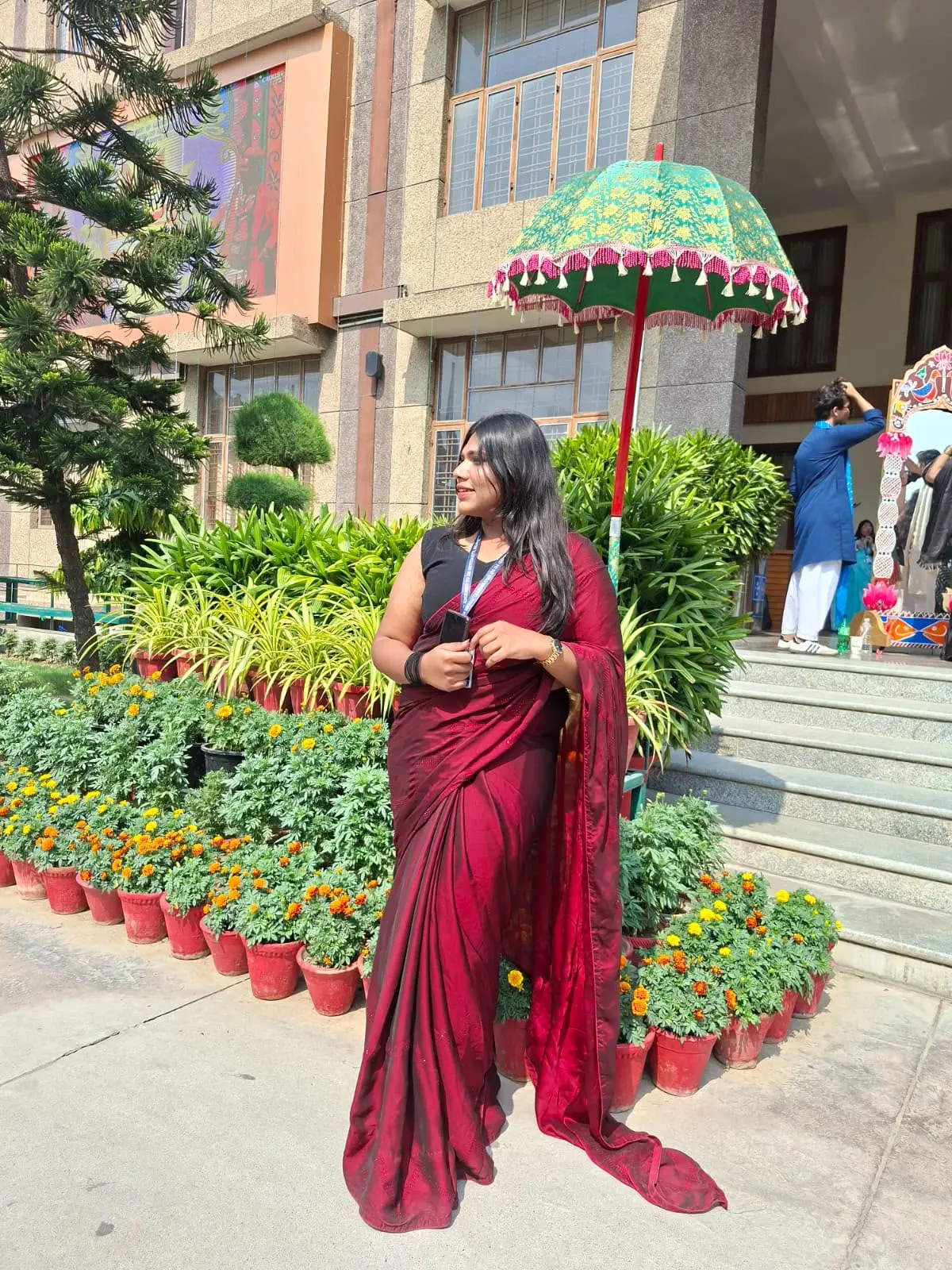 Aradhya Garg in a red saree at a campus event